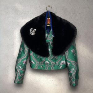 The Baumer in emerald green jacquard with black faux collar & brooch