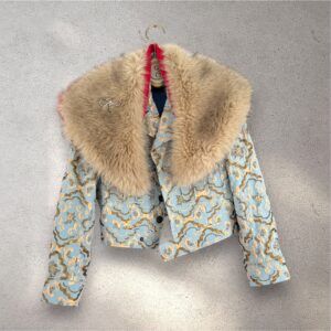 The Baumer in light blue & gold jacquard with faux shoulder collar in greige/red with brooch