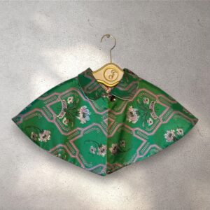 The Capelet reversable emerald green & lilac jacquard