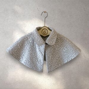 The Capelet reversable pale blue metallic floral jacquard